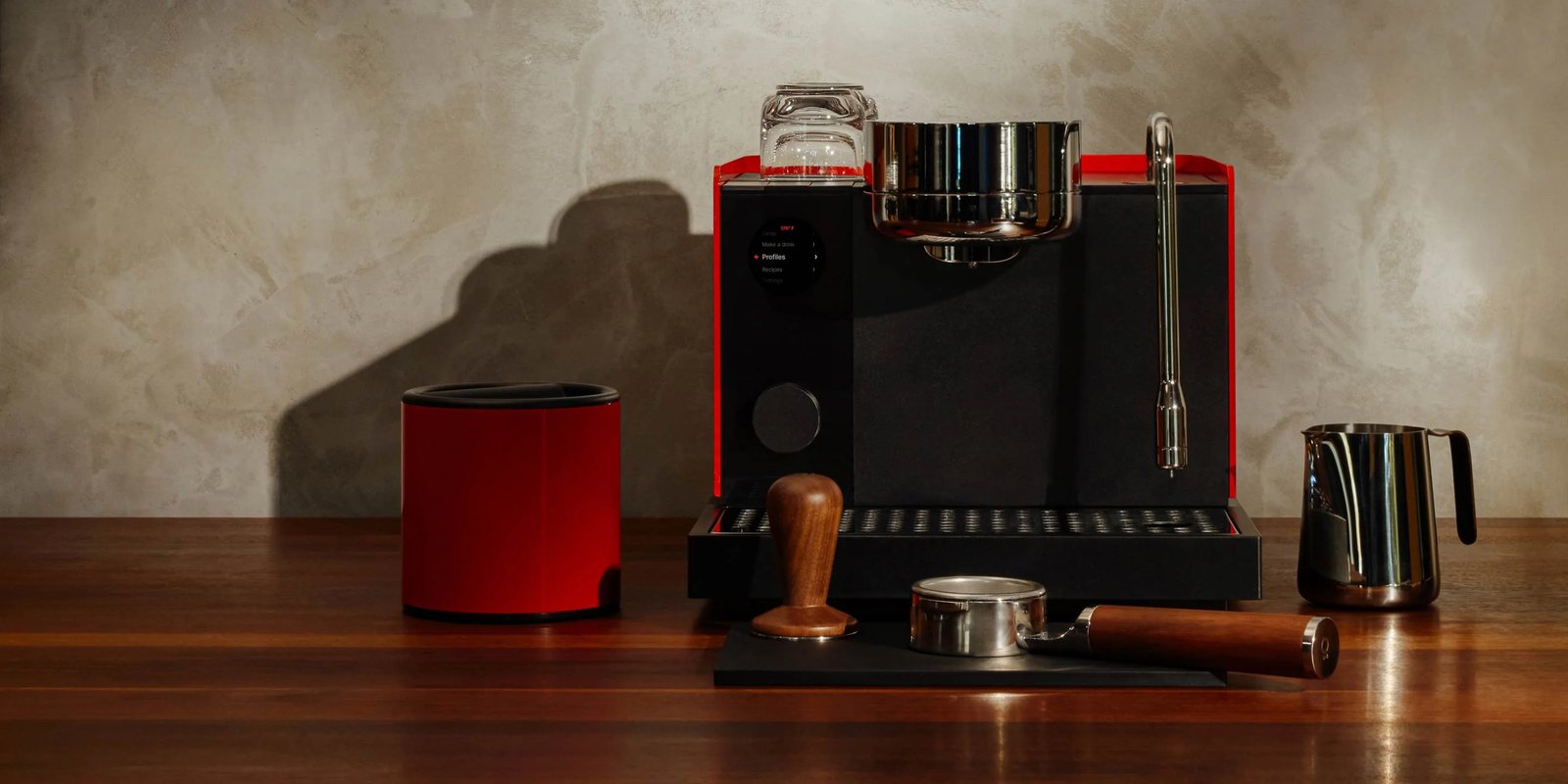 Fellow Espresso Series 1 in red and black on a wooden counter